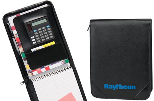 A black binder with a calculator and a pen