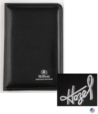 A black leather cover with a white logo and the name of hazel