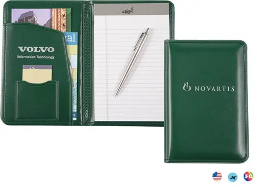 A green folder with a pen and note pad inside of it.