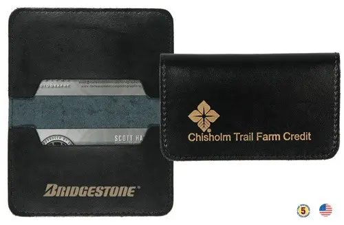 A black leather wallet with the name of chisom trail farm on it.