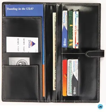 A black leather wallet with multiple cards and money.