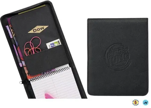 A black leather notebook with a pen and other items.