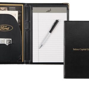 A black folder with a pen and note pad on it.