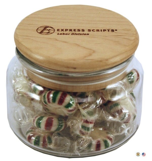 A glass jar filled with candy and a wooden lid.