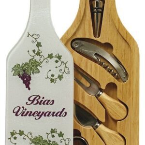 A wine bottle shaped cutting board with cheese tools.