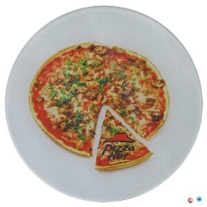 A pizza with one slice missing on top of the plate.