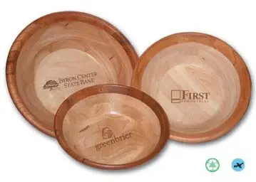 A set of three wooden bowls with the logo for first.