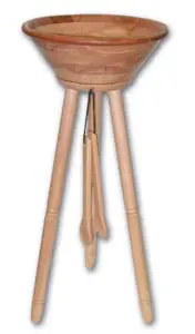 A wooden tripod with a bowl on top of it.