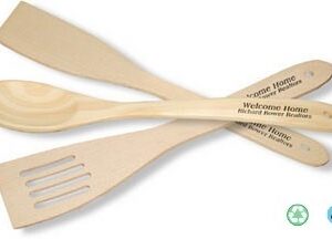 A wooden spoon and fork with the words " welcome home ".