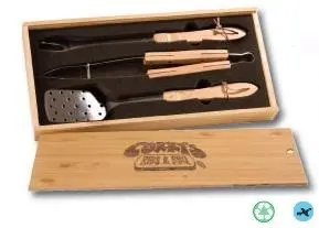 A wooden box with some utensils in it