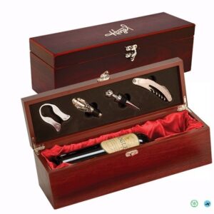 A wine box with two bottles of wine and four wine accessories.