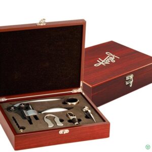 A wooden box with wine accessories in it.
