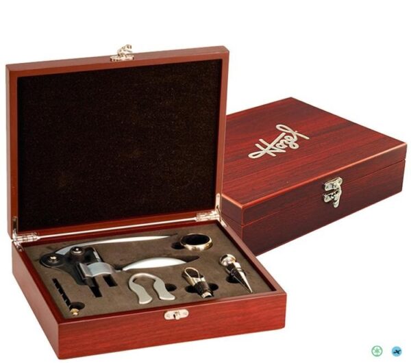 A wooden box with wine accessories in it.