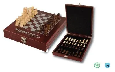 A wooden chess set with pieces in the box.