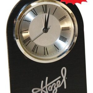 A clock that is sitting on top of a table.