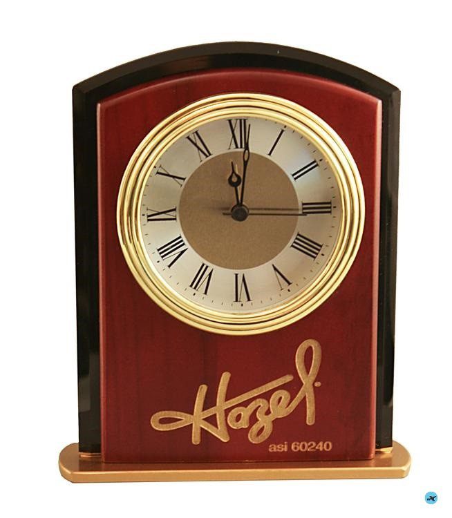 A clock that is sitting on the side of a table.