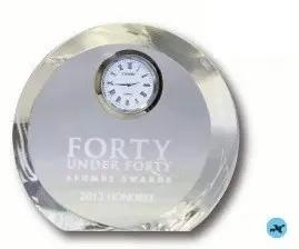 A round clock with the words forty under forty on it.