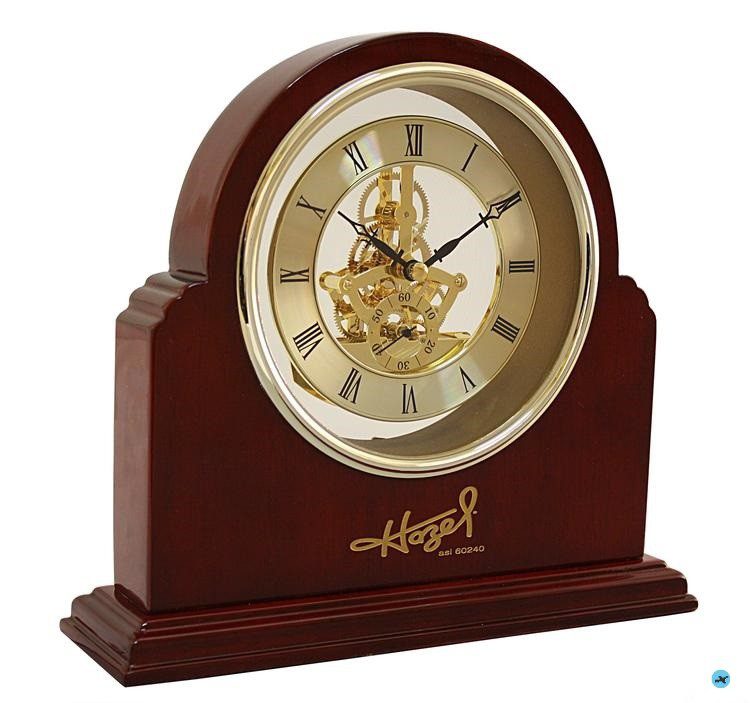 A clock that is sitting on top of a table.