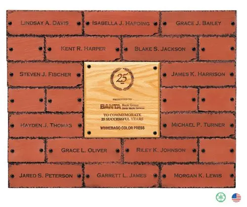 A brick wall with some bricks and a plaque