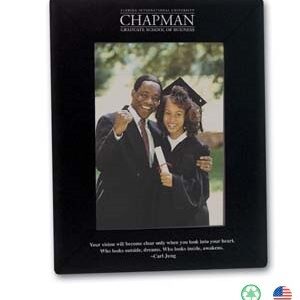 A picture of two people in graduation attire.