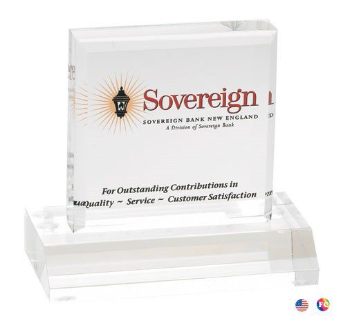 A square shaped acrylic block with the word sovereign on it.