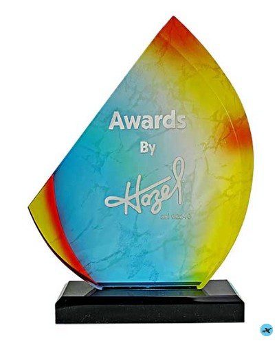 A glass award with the words " awards by hazem ".