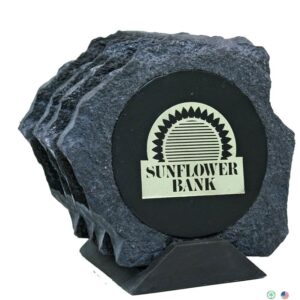 A set of four coasters with the name sunflower bank on them.