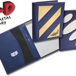 A blue book with some white and gold paper on it