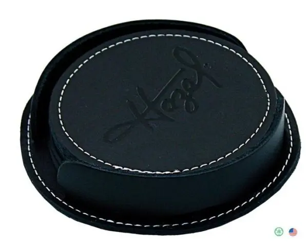 A black leather coaster with the word hope written on it.