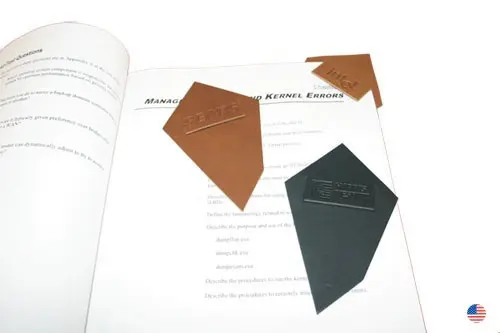 A book with some papers and some shapes