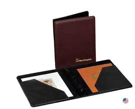 A brown leather folder with two different colored pages.