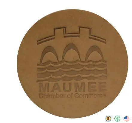 A brown leather coaster with the name of maumee