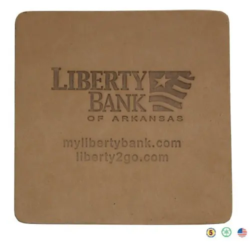 A square coaster with the liberty bank logo on it.