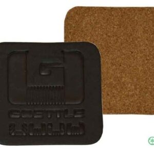 A square coaster with the letter g on it.