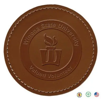 A brown leather coaster with the words wilkes state university and villanova university.