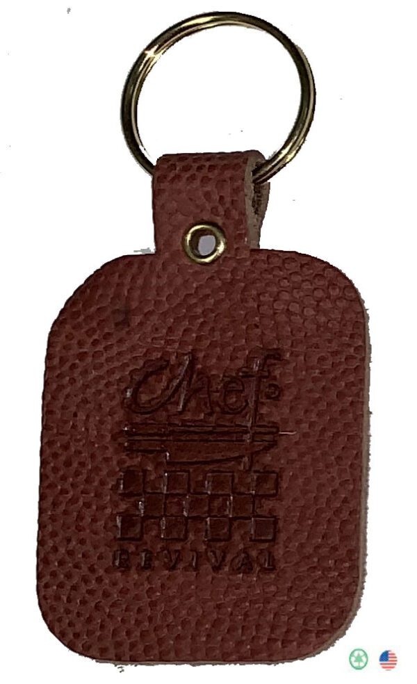 A brown leather key chain with the word chief on it.