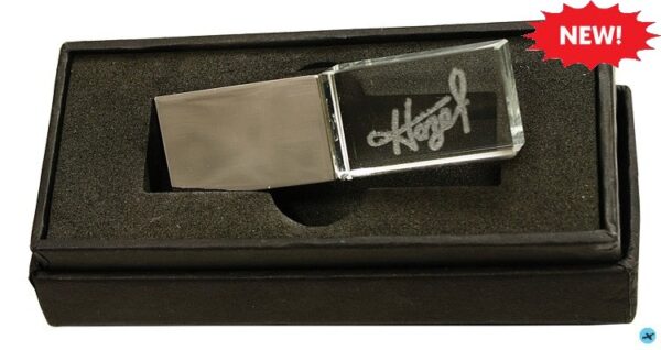 A metal and glass money clip in its box.