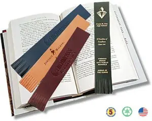 A book with several different colored bookmarks on it.