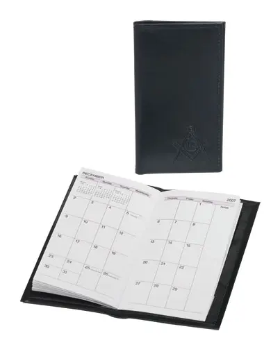 A black leather calendar with a white calendar on top.