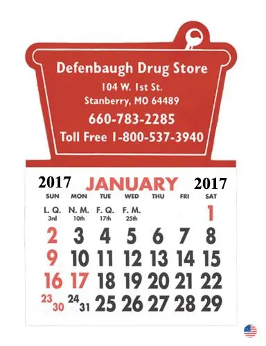 A red calendar with the words " defenbaugh drug store " on it.